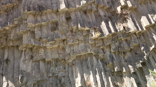 Majestic in a Sunny Canyon Texture. Columnar Basalt Rock Formation under Blue Sky. Garni Gorge, Symphony of the Stones, Armenia. 
