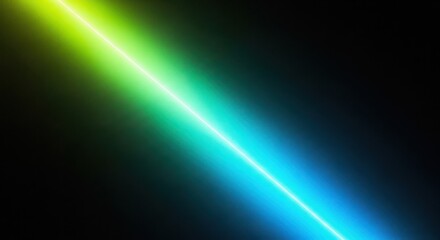 Fototapeta premium Abstract background with a diagonal beam of light transitioning from bright yellowgreen to vibrant cyan against a dark, grainy textured backdrop