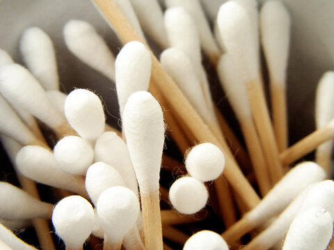 Macro close-up of cotton swabs with soft texture, hygiene and personal care concept