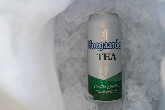 Bangkok, Thailand - March 31, 2026 : Hoegaarden TEA, Jasmine Oolong Tea, 500ml cans placed on ice, 500ml cans