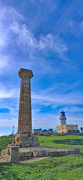 Lighthouse and Roman column at Capo Colonna, Crotone, Italy