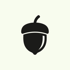Fototapeta premium Simple black acorn icon representing nature and its elements in a minimalist style.