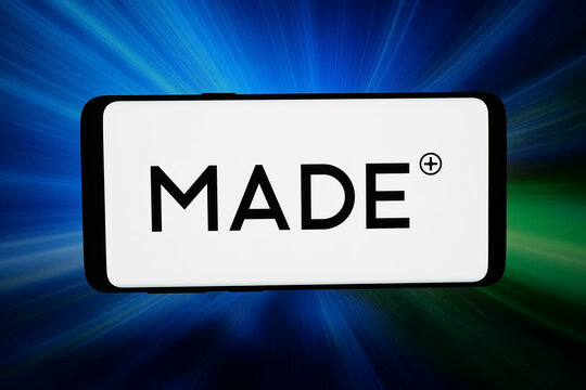Stuttgart, Germany - 03-26-2026: In this photo illustration, the logo of British e-commerce company Made.com is displayed on a smartphone in front of abstract background on computer screen.