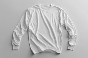 White long sleeve shirt lying on white background.