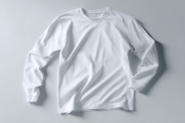 White long sleeve shirt lying on white background.
