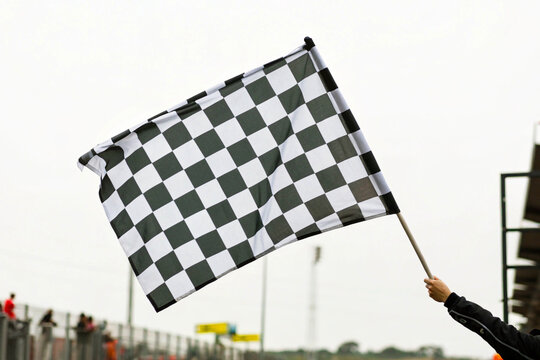 checkered flag on a blue sky background