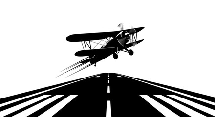 Biplane taking off from runway in a striking black and white silhouette. © Joko