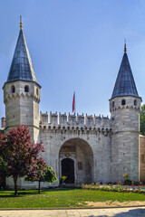 Fototapeta premium Gate of Salutation to the Second Courtyard of Topkapi Palace in Istanbul, Turkey. Ottoman castle architecture under blue sky