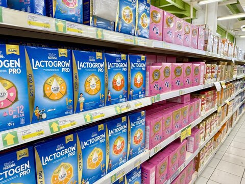Depok, Indonesia - March 31, 2026: A variety of baby and kids formula milk products from Lactogrow and S26 brands are displayed on a retail aisle rack at Tip Top Supermarket in Depok, West Java.