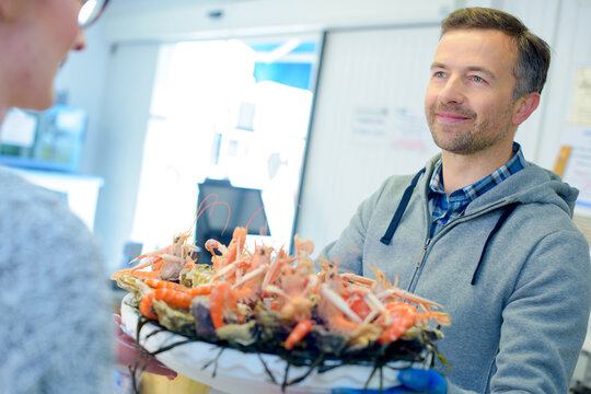 a fishmonger and a seafood platter