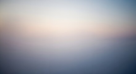 Fototapeta premium Abstract blurred gradient background with soft transitions from light to dark tones.