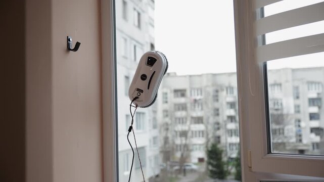 Automatic Window Cleaning Robot Working on a Tall Glass Window