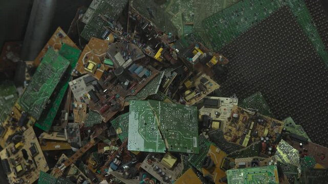 Careful Analysis Of Stacked Electronic Circuitry And Solder Joints Inside Metal Container To Illustrate Waste . Media