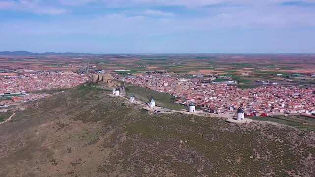 Aerial View of Consuegra Windmills with Historic Town in Background &ndash; Iconic Travel Destination in Castilla La Mancha, Spain