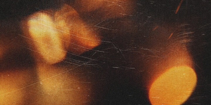 A pixelated image of brown and yellow objects on a dark background