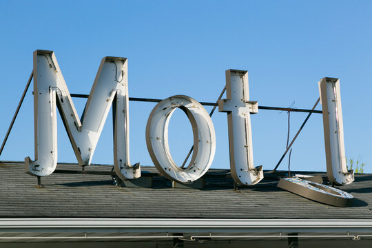 Vintage Motel Sign Letters Against Blue Sky on Route 66
