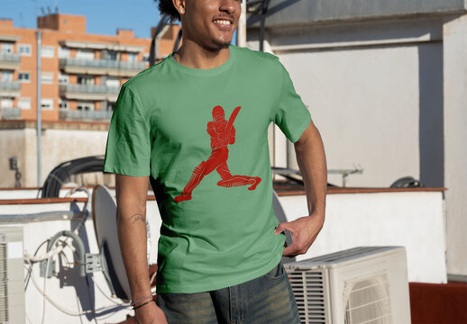 Mockup of Man Wearing a White T-Shirt on a Rooftop