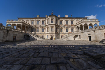 Obraz premium Renaissance Pidhirtsi Castle with dramatic storm clouds in Ukraine
