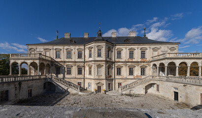 Obraz premium Renaissance Pidhirtsi Castle with dramatic storm clouds in Ukraine