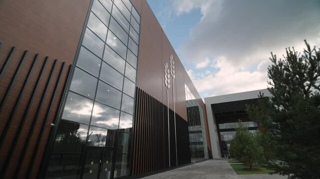 The facade of a modern building for the production of bread products. Dolly camera
