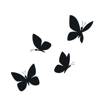 Four black butterfly silhouettes are elegantly displayed in various flight and resting poses, isolated on a clean white background for versatile design use