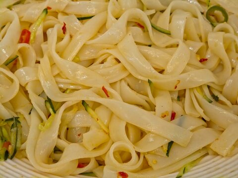 Shaanxi-style cold rice noodles (Liangpi) mixed with cucumber shreds and chili oil