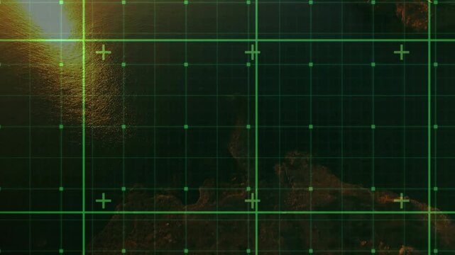 Radar grid with crosshairs overlaying coast, sun brightening left and revealing town for mapping