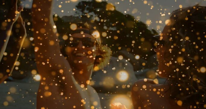 Gold bokeh sparking pair celebrating by water raising arms drifting veil showing joy shades leisure