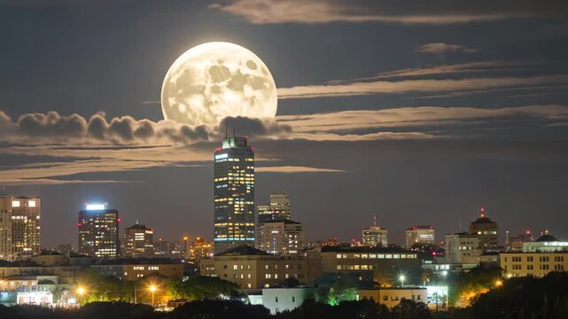 High-hanging full moon in city night view City night view and supermoon