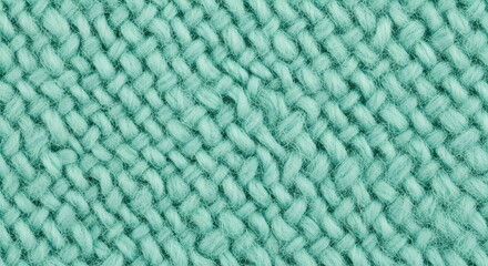 Close up of aqua green knitted fabric texture with woven pattern detailed background.