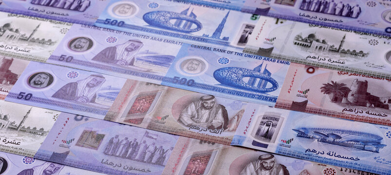 United Arab Emirates cash, dirhams and coins for exchange and financial transactions. UAE currency
