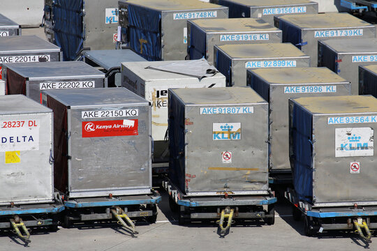 Schiphol, Netherlands - August 27, 2013: type LD3 unit load devices on dollies at Amsterdam Airport Schiphol