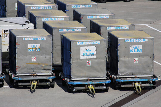 Schiphol, Netherlands - August 27, 2013: type LD3 unit load devices on dollies at Amsterdam Airport Schiphol