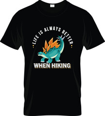 Black t shirt featuring a teal stegosaurus dinosaur with orange back plates and the text life is always better when hiking printed in white and yellow block letters © Sharasoti Rani Das