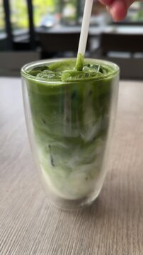 Stirring a Iced Matcha Latte