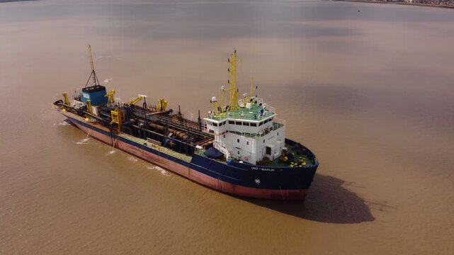 Trailing suction hopper dredger on the river Hull.
