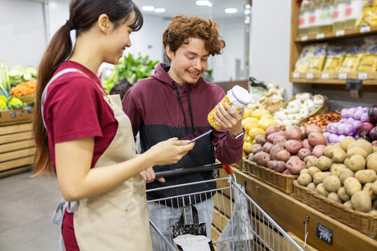 Grocery shopping with store assistant in fruit market