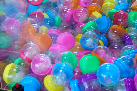 Colorful plastic capsules in claw machine game vending prizes toys