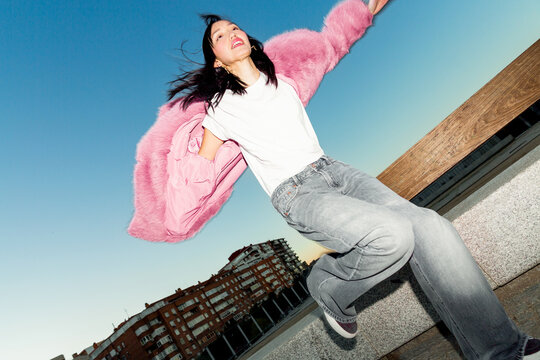 Urban lifestyle portrait of a carefree Gen Z woman