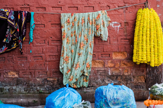 Traditional Indian scene with garments and marigold garlands
