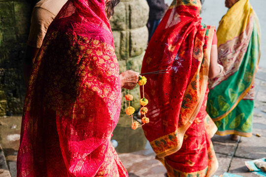 Traditional Indian Women in Vibrant Sarees Celebrating Ritual