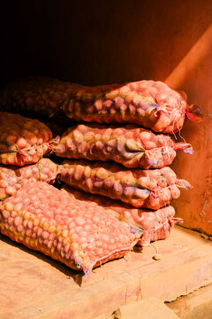 Sacks of onions in vibrant Indian market