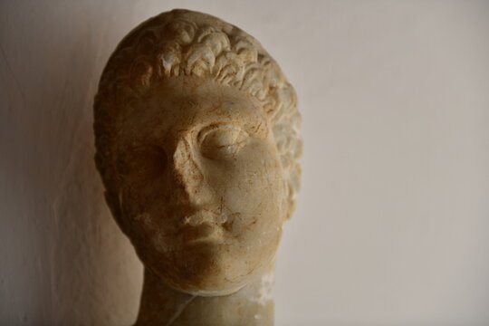 Ephebe, Rhodes town, Rhodes Island, Greece. The damaged human face of Ephebe from the late Hellenistic period.