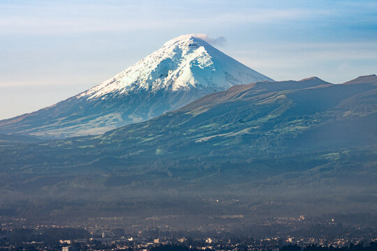 Snow-capped Cotopaxi volcano rising above Andean landscape near Quito Ecuador
