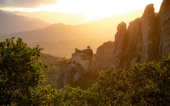 Rousanou (St. Barbara) Monastery at sunset, resting on a steep rock pillar in the UNESCO World Heritage site of Meteora, Greece