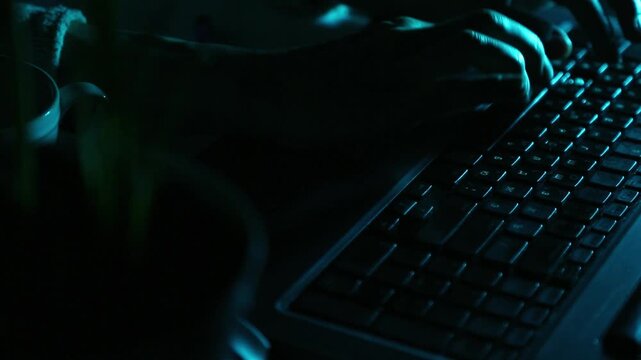 Business woman typing the fingers on keyboard with real sound typing on the keyboard.  Low key shadow with blue art lighting. Closeup series of videos from different angles