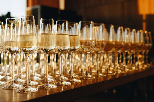 Row of Champagne Glasses at Sunset