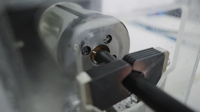 Industrial cable stripping process in an industrial production plant setting