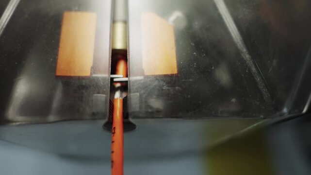 Close view of wire isolation stripping manufacturing machine processing in cable production plant