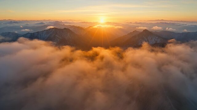 Majestic mountain range piercing through golden clouds at breathtaking sunset landscape